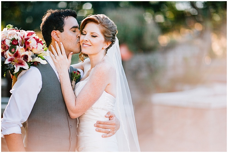 Springs Preserve Wedding Photos groom kisses bride