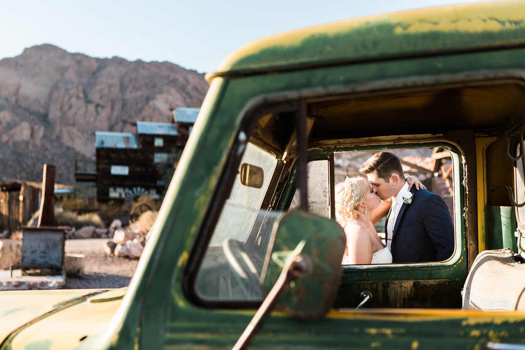 el dorado canyon wedding photo couple kisses near truck