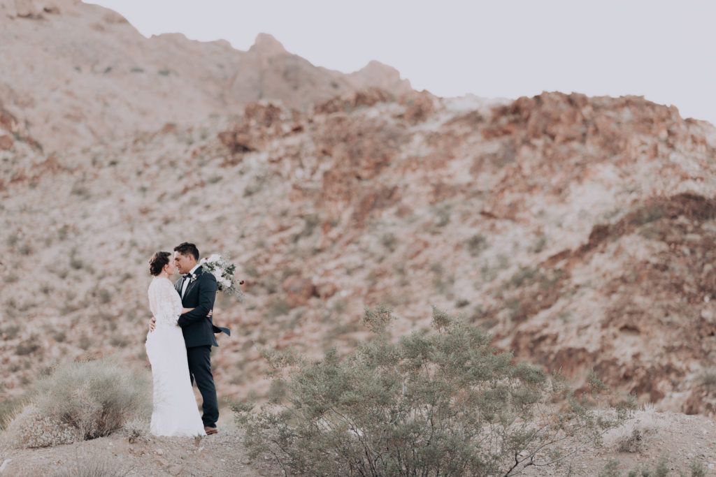 las vegas desert elopement bride and groom kiss in desert