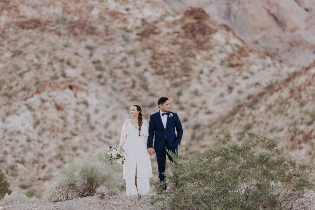 las vegas desert elopement bride and groom strike pose 