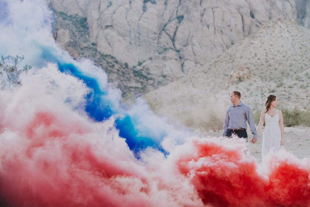 nelsons ghost town wedding photos bride and groom pose with smoke bombs in foreground