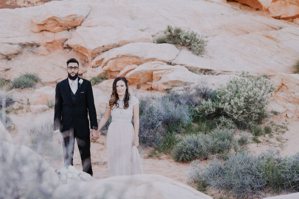 valley of fire wedding photos bride and groom looking at camera